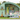 Miniature summer caravan with pastel camper, picnic setup, and floral decor